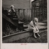 Children on the steps of a dilapidated house, Michigan?