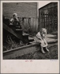 Children on the steps of a dilapidated house, Michigan?