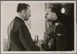 The Fuhrer received the Commander of Bodyguards, Chief SS Group Leader and General of the Waffen-SS, Sepp Dietrich, at his headquarters and decorated him with the Knight's Cross with Oak Leaves.