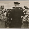 Standing at attention, Lieutenant Commander Lemp reports his U-boat's return from a successful patrol.  47,000 Gross Registered Tons (of shipping) have been taken out of the British supply.  The Commander received the Knight's Cross and the crew the Iron Cross.