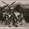 Even the worst winter storms don't stop the German Air Force from flying its missions.  Here, ground crewmen make preparations wearing sou'westers and raincoats.