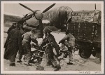 Even the worst winter storms don't stop the German Air Force from flying its missions.  Here, ground crewmen make preparations wearing sou'westers and raincoats.