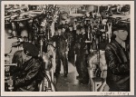 [A look inside the engine room of a German battleship.  On the effort and reliability of these men the speed and therefore the combat strength of the ship for the most part depends.]