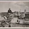 [The most successful fighter pilot on the African Front, Knight's Cross winner Lieutenant Marseille, who has since gained his 30th victory, near a fighter plane he destroyed.]