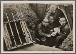 Just as important as what is sent by the "goulash cannon" (field kitchen) is news from home, and when the field post arrives, the off-duty men sit in their dug-outs and read about home.