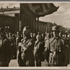 On November 9th, under the Blood Flag, an act of consecration took place in Munich for the victims of the (National Socialist ) Movement and the German freedom struggle.  Next to the standard-bearer Jakob Grimminger is a SS leader with the Knight's Cross.