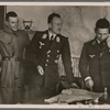 Day by day the German Air Force delivers powerful blows against England.  In the command post of an air field, the fliers get orders to lay waste to harbors, docks and warehouses.