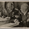 [... a peaceful revision of the Rumanian-Hungarian border.  Our pictures show Reichs Foreign Minister von Ribbentrop presenting the agreement and Rumanian Foreign Minister Manoilescu at the signing.]