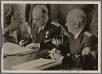 [... a peaceful revision of the Rumanian-Hungarian border.  Our pictures show Reichs Foreign Minister von Ribbentrop presenting the agreement and Rumanian Foreign Minister Manoilescu at the signing.]