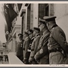 [... Berlin was festively decorated.  Flags and garlands greeted the victors over France.  On the balcony of the Reichs Chancellery we see the Führer with his generals and the Foreign Minister (from left: Field Marshal Goering, the Führer, Grand Admiral Raeder, Colonel-General von Brauchitsch, Foreign Minister von Ribbentrop, Colonel-General Keitel).]