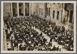 In the courtyard of the new Reich Chancellery, the Fuhrer partakes of the "one-pot" communal stew meal in the company of invited fellow citizens.