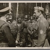 On June 4th Adolf Hitler made a surprise visit to the headquarters of Marshal Mannerheim of Finnland in order to personally deliver his best wishes and those of the German people on the occasion of the Marshal's 75th birthday.  The Fuhrer in conversation with Field Marshal Mannerheim; at left General Field Marshal Keitel; between the two statesmen Reich Press Chief Dr. Dietrich.