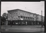 Row of wood frame buildings; Furnished Rooms sign: Surf Av-W. 22nd St., Brooklyn