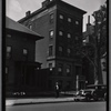 Inspector on street outside buildings