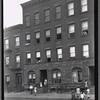Street view with tenement residents