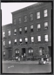 Street view with tenement residents