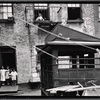 Children posed in rear tenement courtyard