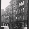 Storefronts and tenements; Angelo's Barber Shop