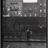 School boy in front of tenements and El