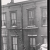 Wood frame tenements with fire escapes