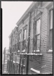 Wood frame tenements with fire escapes