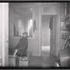 Tenement interior with male resident