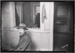 Tenement interior with male resident