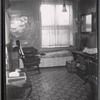 Tenement interior; kitchen coal stove, bed