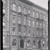 Tenement row; barber in first floor apartment