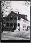 Stucco residence with porch: Bronx?