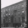 Row houses with residents on stoop