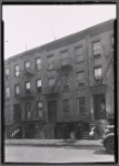 Row houses with residents on stoop