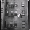 Tenement rear view with family posed in window