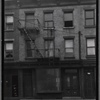 Row houses with vacant storefront