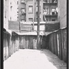 Rear view of fire escapes and sheds
