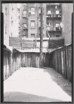 Rear view of fire escapes and sheds
