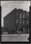 Apartment row with storefronts; J. Brasino Candy Store: 107-04 Otis Ave. - Van Doren St., Queens