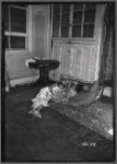 Interior view with two children sleeping on cushions on floor