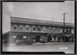 Stucco row houses & storefronts; Hollis Delicatessen: 196-21 Jamaica av-Woodhull Av, Queens