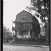 Dutch colonial style shingled house