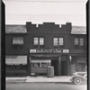 Row houses with storefronts; Skovron's Department Store: 133-03 -07 Cross Bay Blvd-133Av-134 Av, Queens