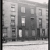 Brick tenements; cobble stone street