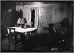 Interior view with table, chests of drawers and cabinets