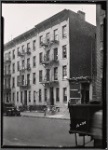 Remodeled tenement row; junk shop