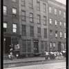 Vacant & renovated tenements; children playing on sidewalk: Manhattan