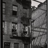 Tenement rear with obstructed fire escape: Manhattan