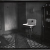 Room interior with sink and armoire