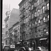 Tenements & storefronts; police car