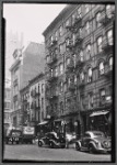 Tenements & storefronts; police car