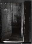 Outhouse interior with "Clean Hands" sign